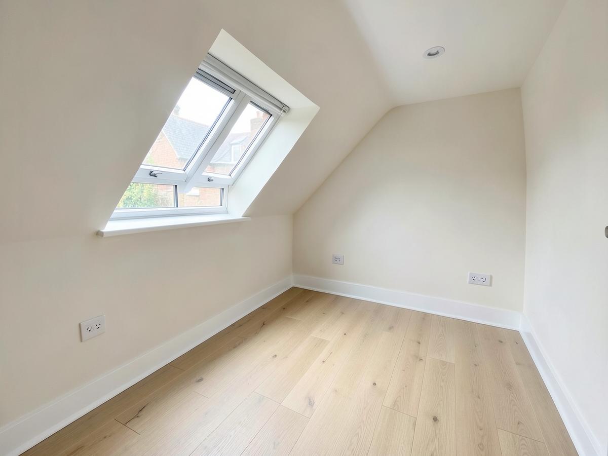 A finished loft conversion with a dormer window